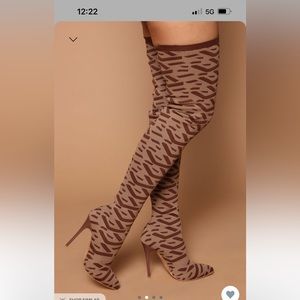 Brown printed knee high heeled boots. Brand new never worn